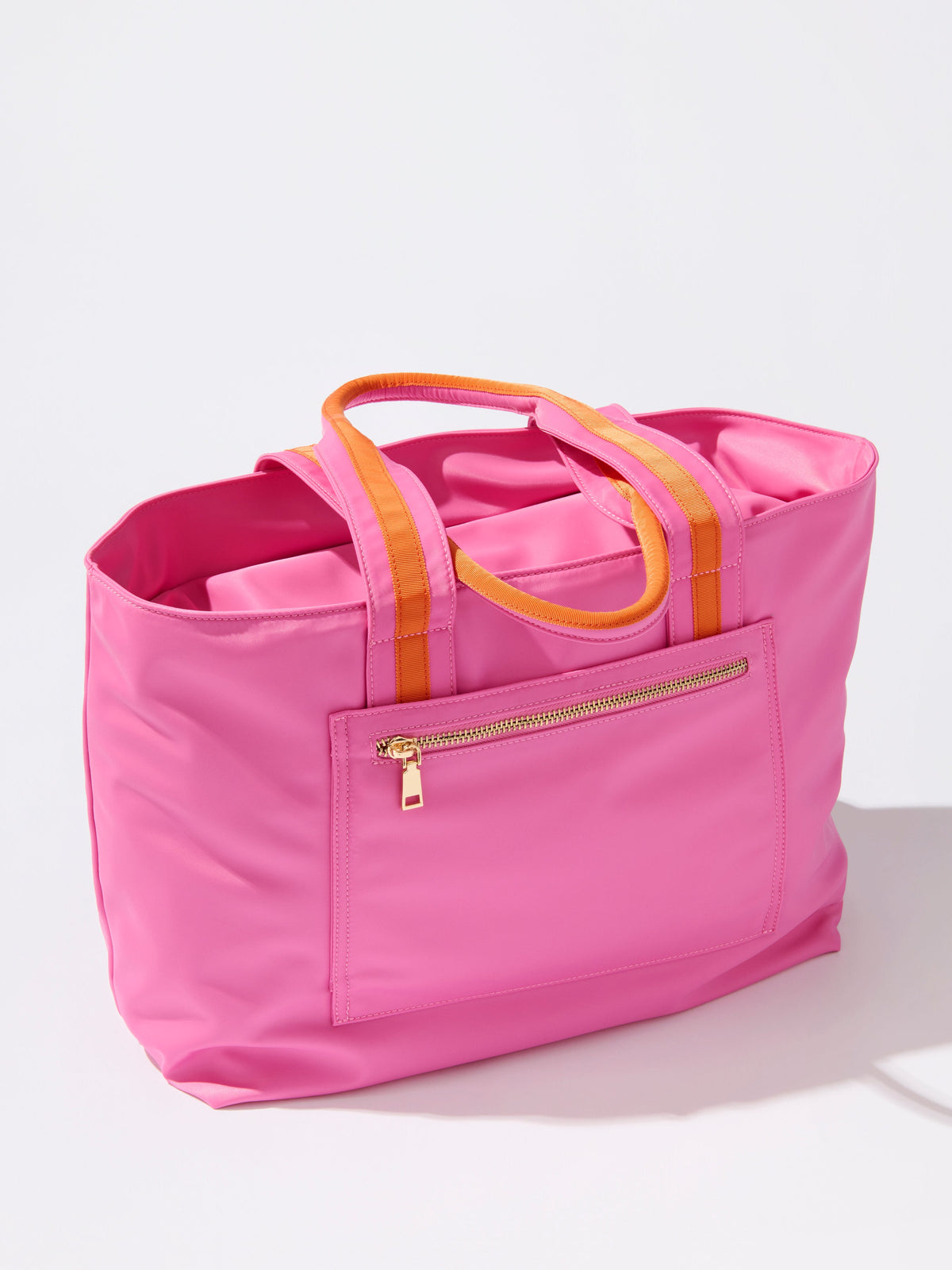 Jet Tote with Trolley Sleeve and Zip Pockets, shown in a styled setting