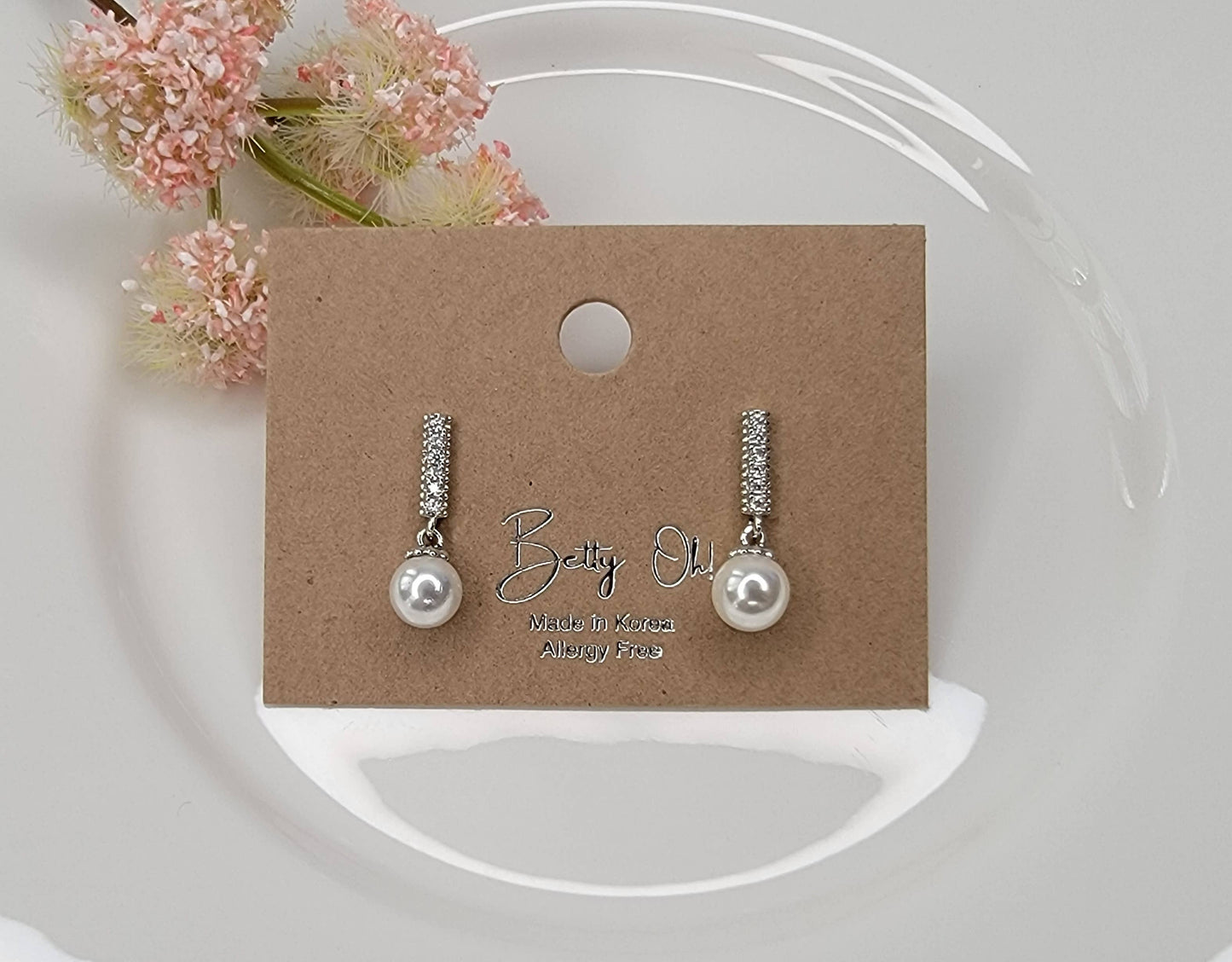 SINGLE PEARL DROP WITH CZ DANGLE EARRINGS.
