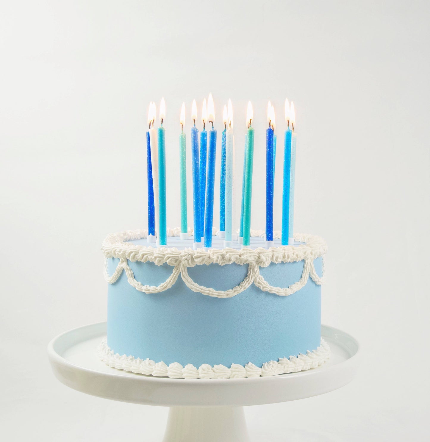 Juego de 16 velas altas con degradado azul