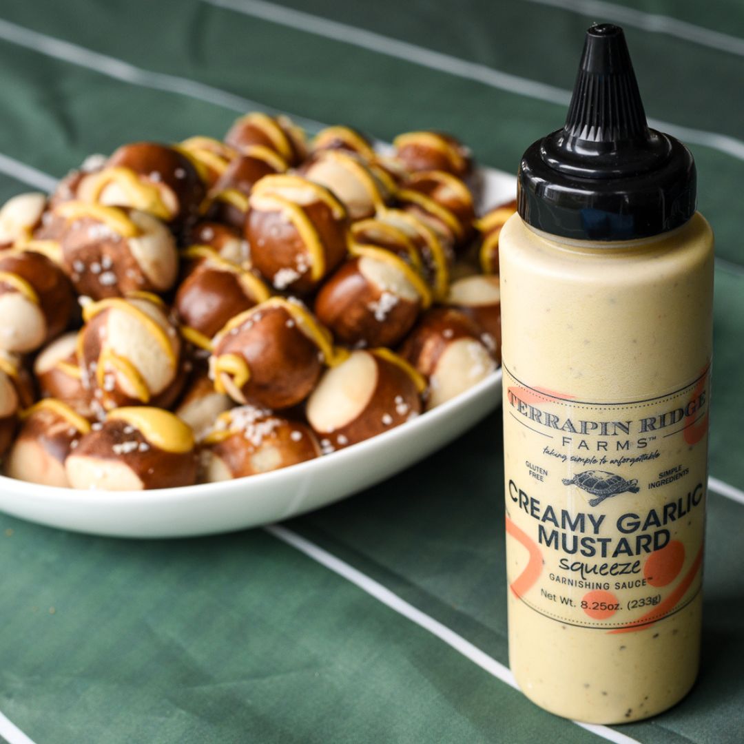 Creamy Garlic Mustard Garnishing Squeeze, 8.25 oz, shown in a styled setting