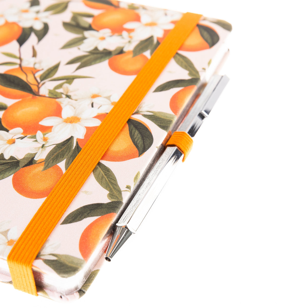 La Petite Presse L'Orange Fabric-Bound Journal with Pen, An orange grove fabric journal, closed with an orange elastic band and a silver pen tucked into a loop.