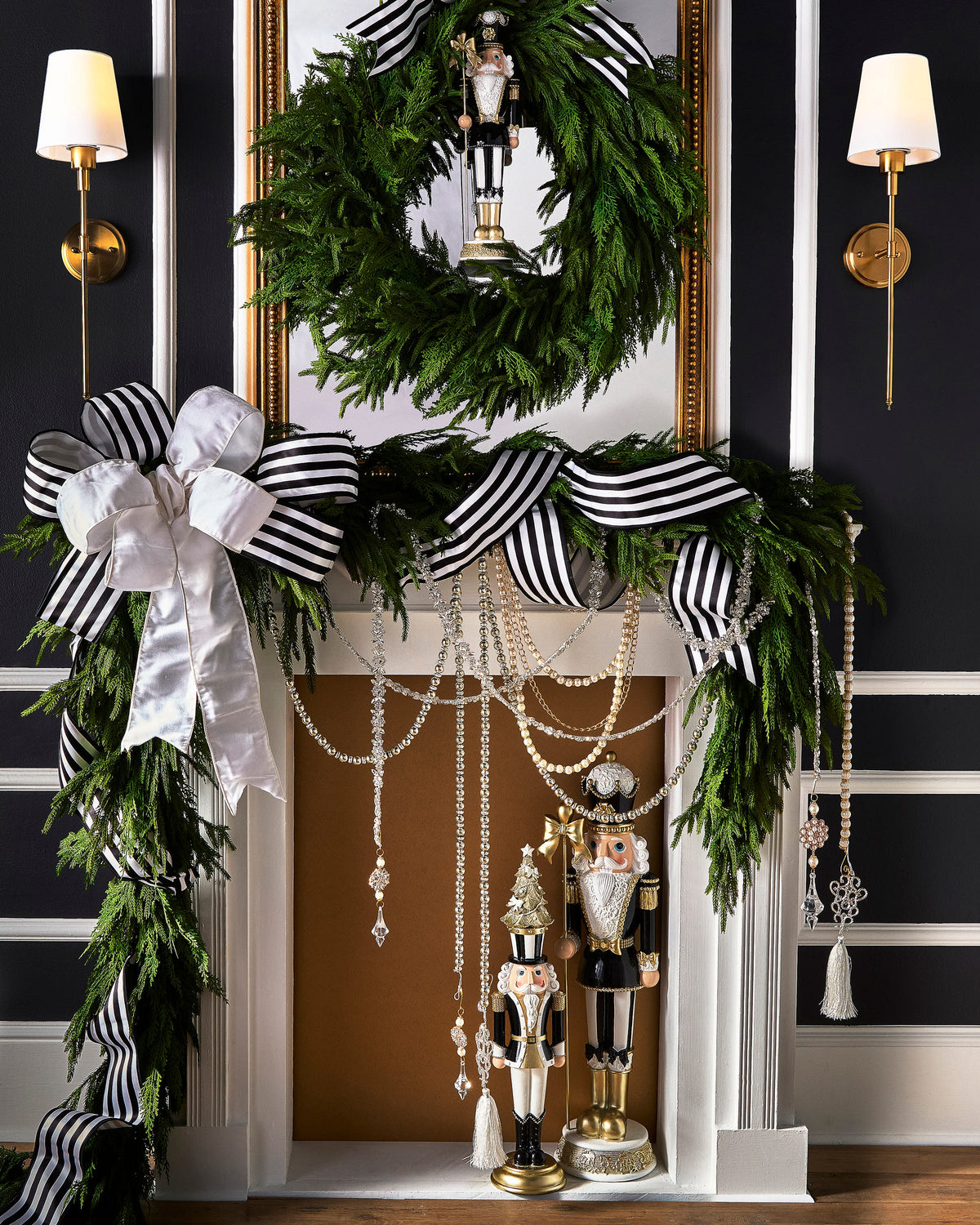 Black Bow Nutcracker, A nutcracker figure in a black and gold crown and coat with a white lace collar, black bows at the knees, gold boots, and a gold bow topped scepter, standing on a gold and white base.