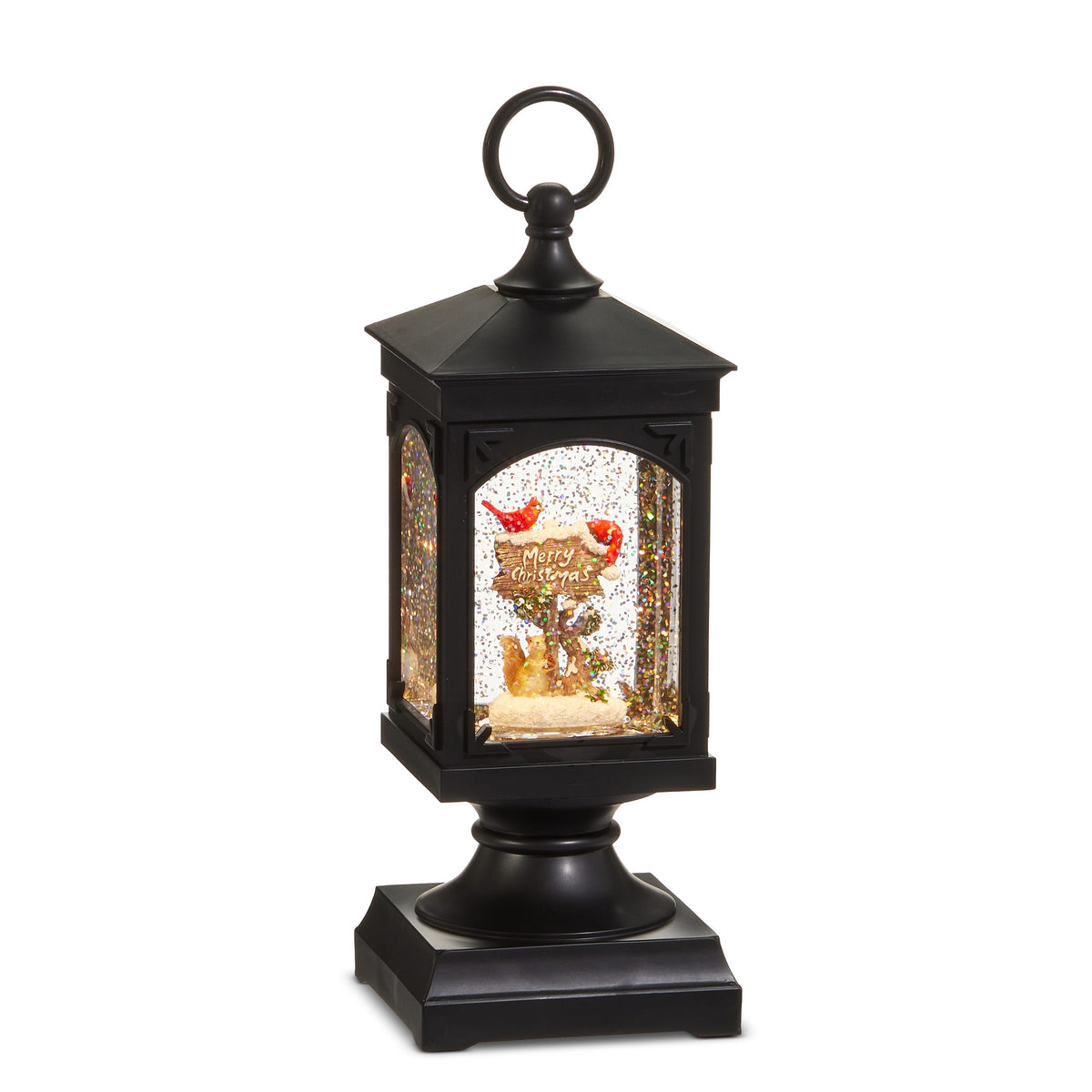Cardinal on Merry Christmas Sign Water Lantern, A black water lantern on a pedestal base with a ring handle, showing a snowy wooden sign reading Merry Christmas with a red cardinal on top and a squirrel at the post, behind a glitter-filled arched window.