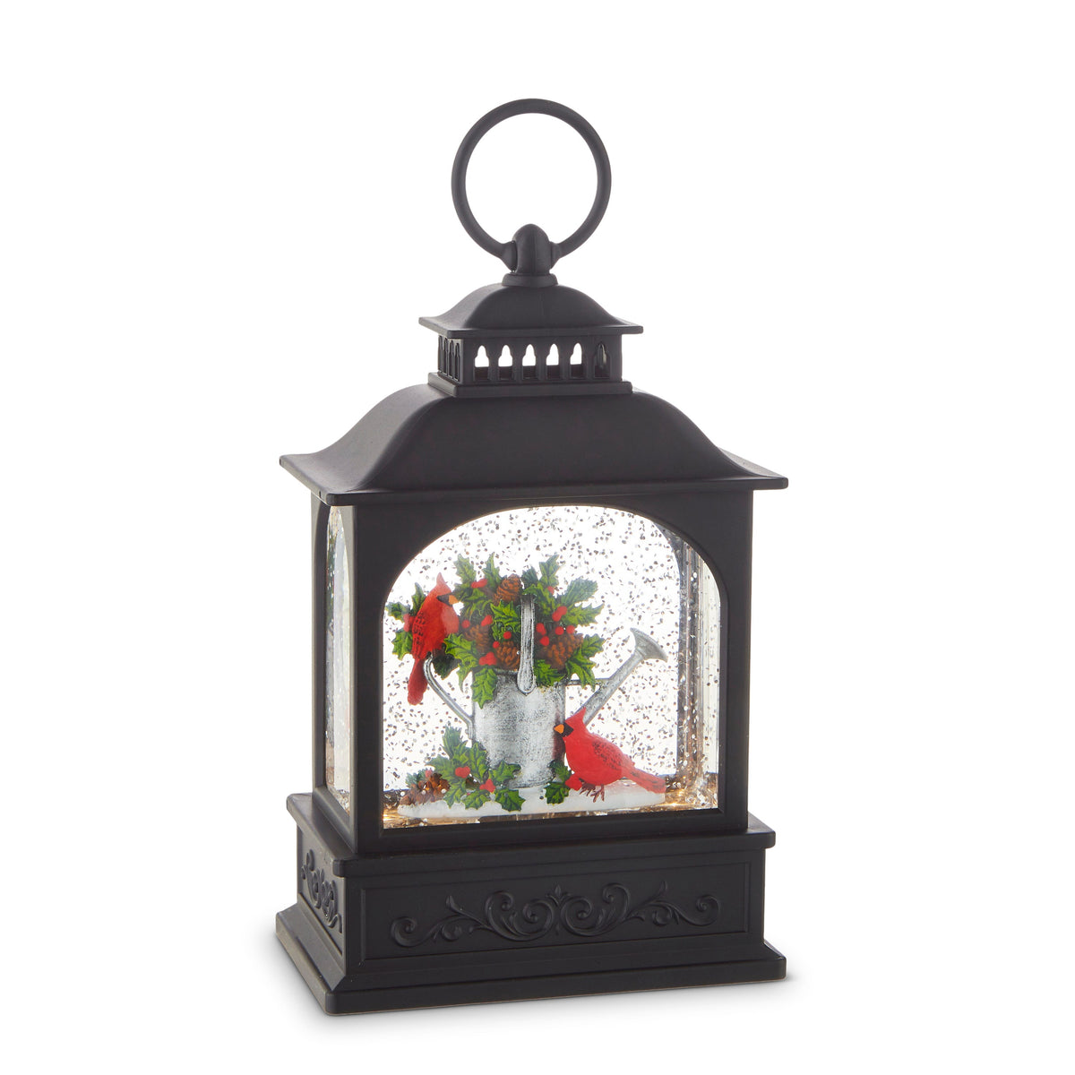 Cardinals and Watering Can Lighted Water Lantern, A black water lantern with a ring handle showing a silver watering can full of holly, berries and pinecones with two red cardinals, behind a glitter-filled arched window.