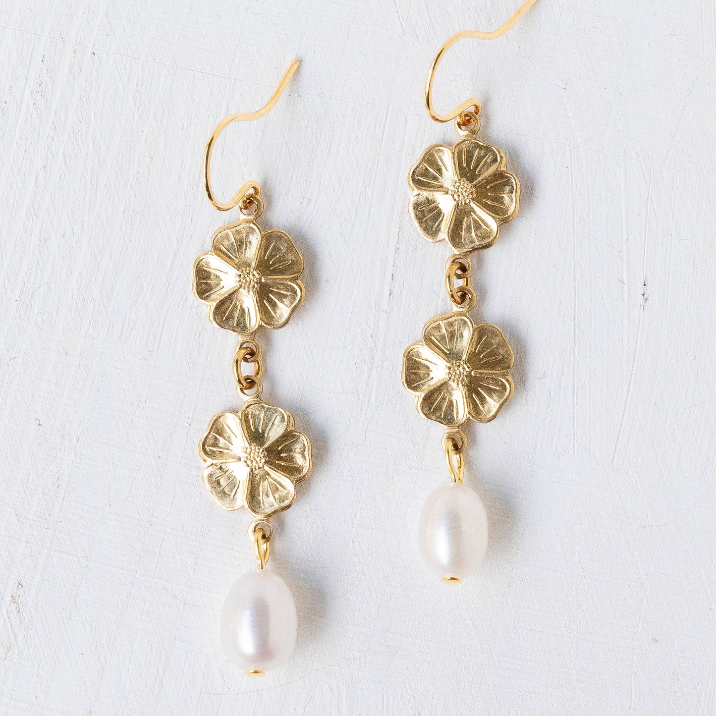 Pearl and two flower dangle earrings