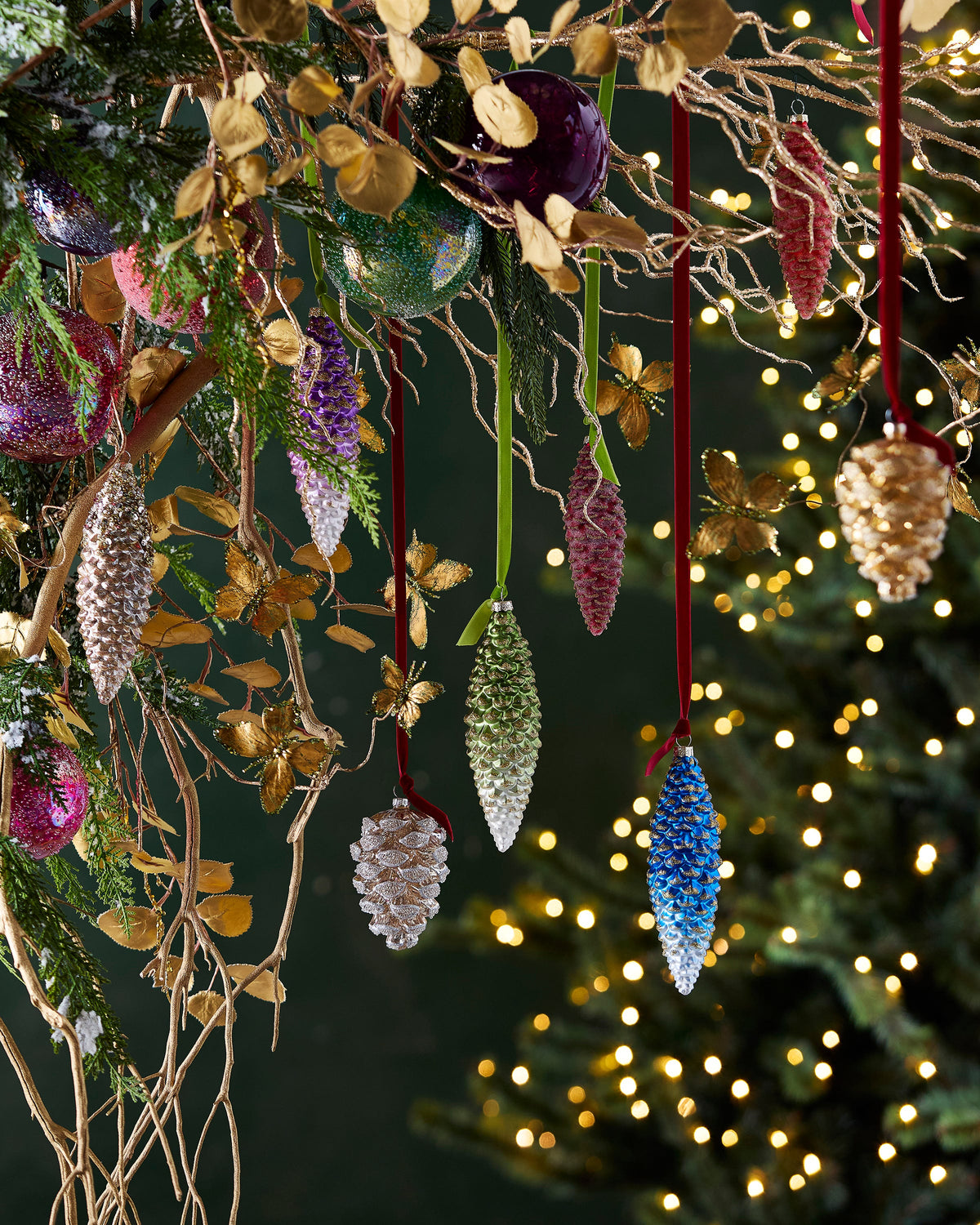 Gold Glittered Pinecone Ornament, An elongated glass pinecone ornament finished in gold and champagne glitter with beaded and jeweled detail at the top.