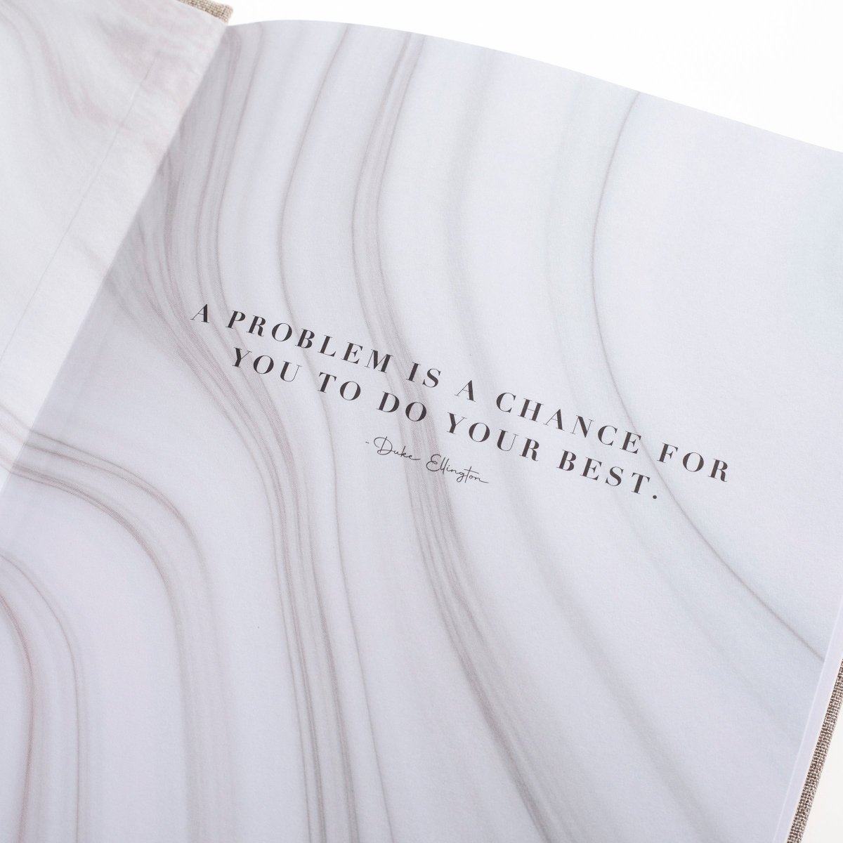 Positive Mind Self-Care Journal, A heathered gray fabric journal with 'positive mind' foiled in white above 'a journal for self-discovery and reflection'.
