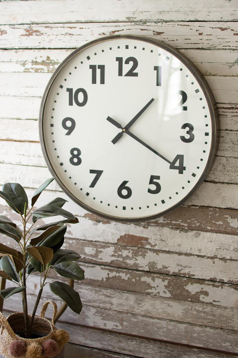 Round Black and White Wall Clock, A round wall clock with a black and white face.