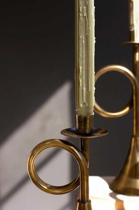 Antique Brass Trumpet Taper Candle Holder, Three antique brass taper candle holders shaped like trumpets in three heights.