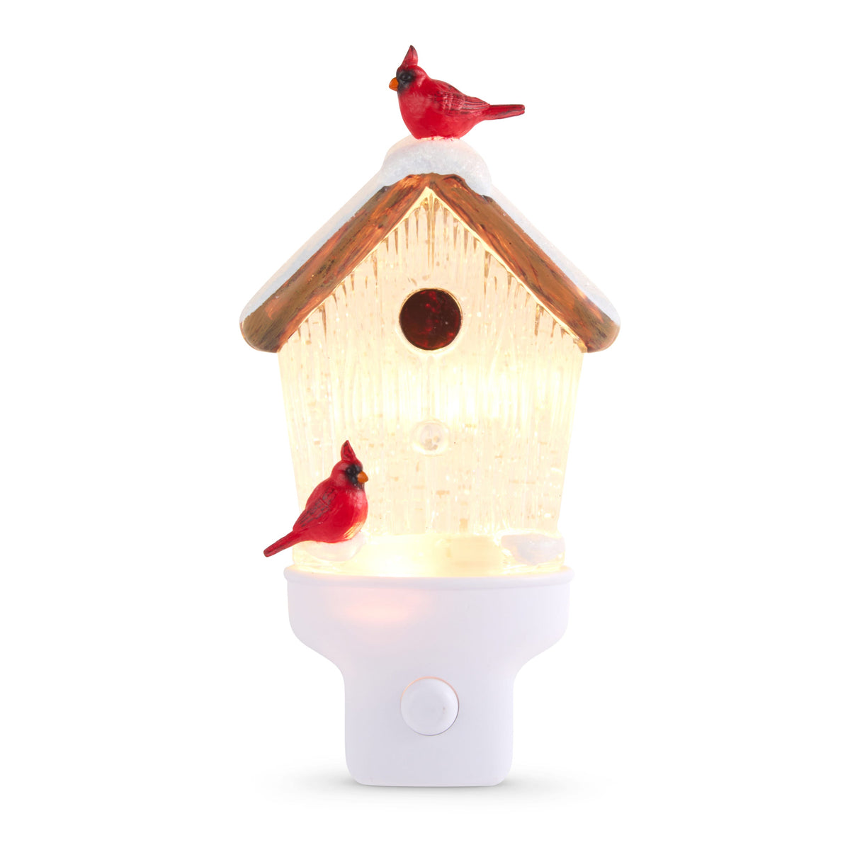Swirling Glitter Birdhouse Night Light with Cardinals, A lit clear birdhouse night light with a snow-topped brown roof, one red cardinal on the roof and another near the base, above a white base with a round button.