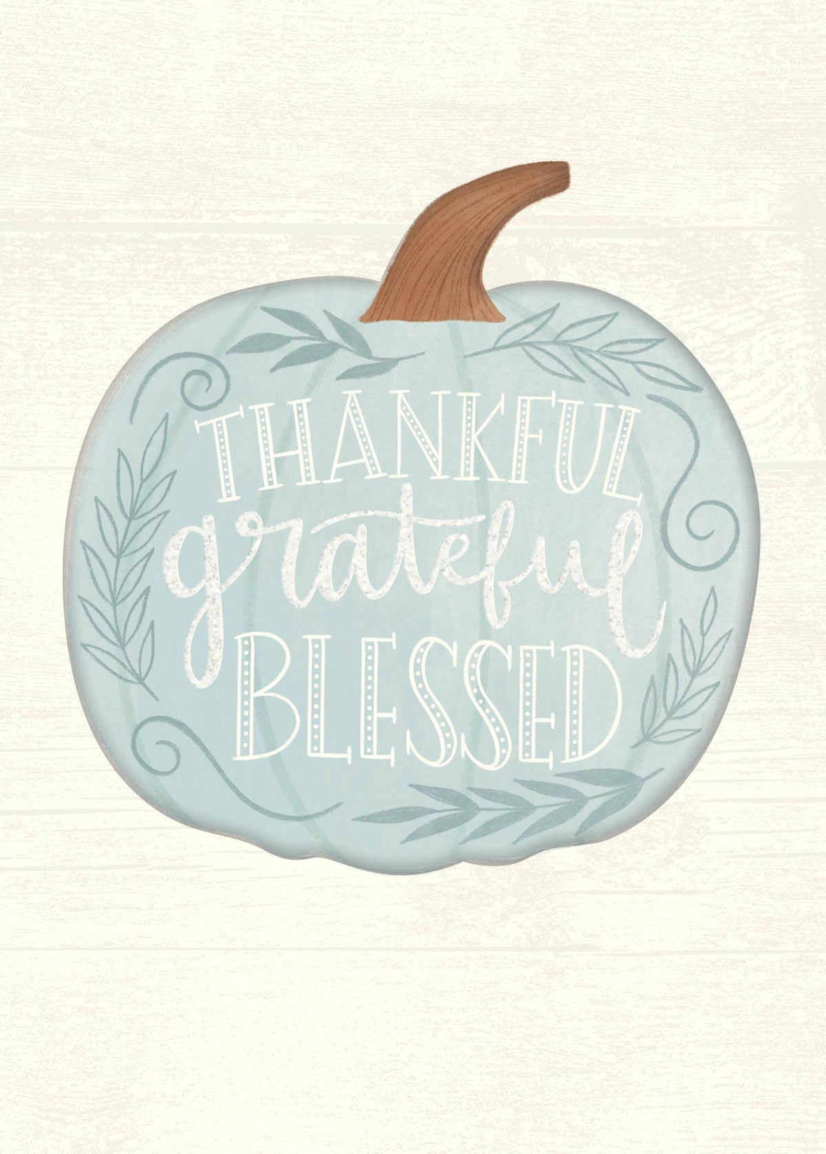 Thankful Grateful Blessed Greeting Card, A cream card front with a pale blue pumpkin carrying the words Thankful, grateful and Blessed in white lettering, framed by leafy sprigs and scrolls.