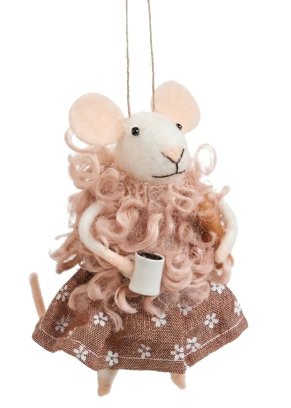 Wool Mouse Ornament with Coffee and Bread, The photo shows a white felted mouse ornament in a brown floral print dress with a curly pink wool wrap, holding a white coffee mug with a loaf of bread tucked under one arm.