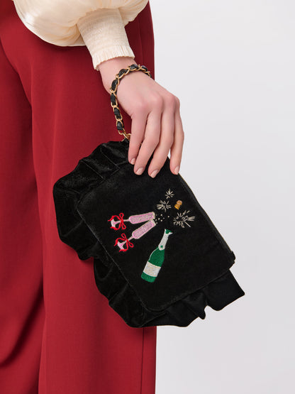 Pop Velvet Wristlet with Champagne Embroidery, Black, shown in a styled setting
