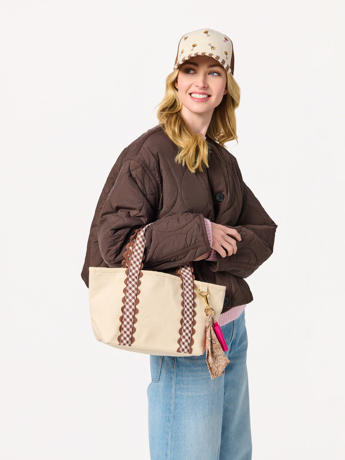 Darling Gingham Strap Canvas Mini Tote, Brown, A cream canvas mini tote with brown and white gingham handles edged in brown scalloped trim and a gold D ring on the side.