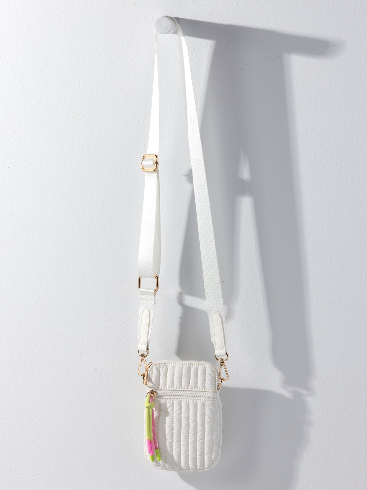 Logan Shiny Quilted Nylon Phone Holder Crossbody Bag, shown in a styled setting