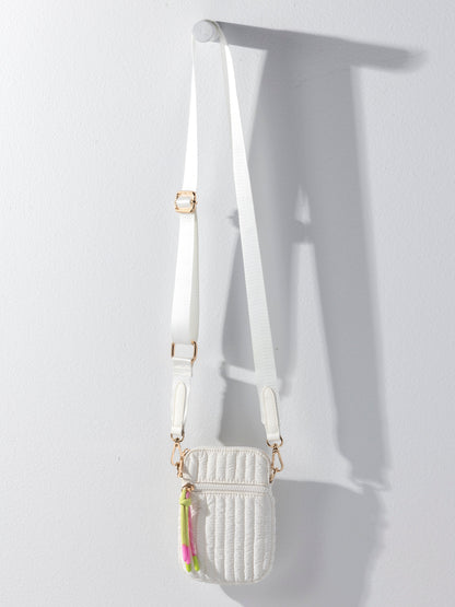 Logan Shiny Quilted Nylon Phone Holder Crossbody Bag, shown in a styled setting