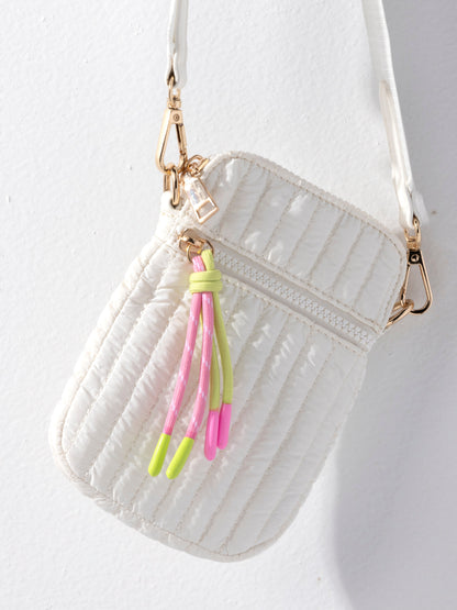 Logan Shiny Quilted Nylon Phone Holder Crossbody Bag, shown in a styled setting