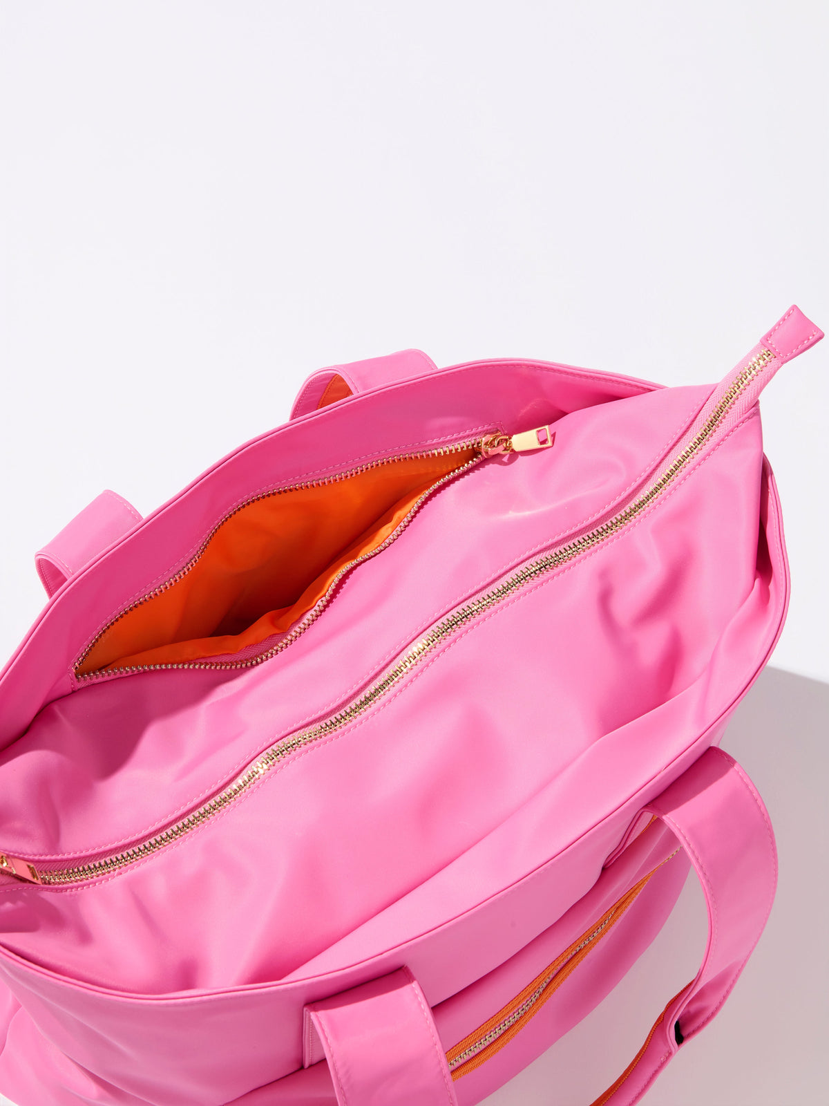 Jet Tote with Trolley Sleeve and Zip Pockets, shown in a styled setting