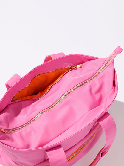 Jet Tote with Trolley Sleeve and Zip Pockets, shown in a styled setting