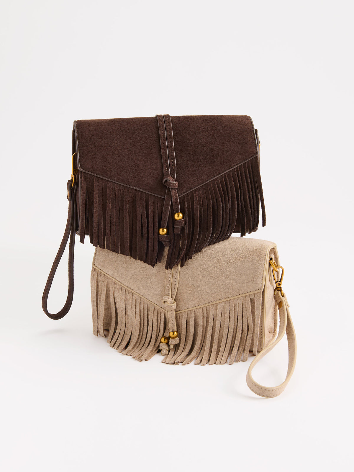 Janis Fringe Cross-Body Bag and Wristlet, shown in a styled setting