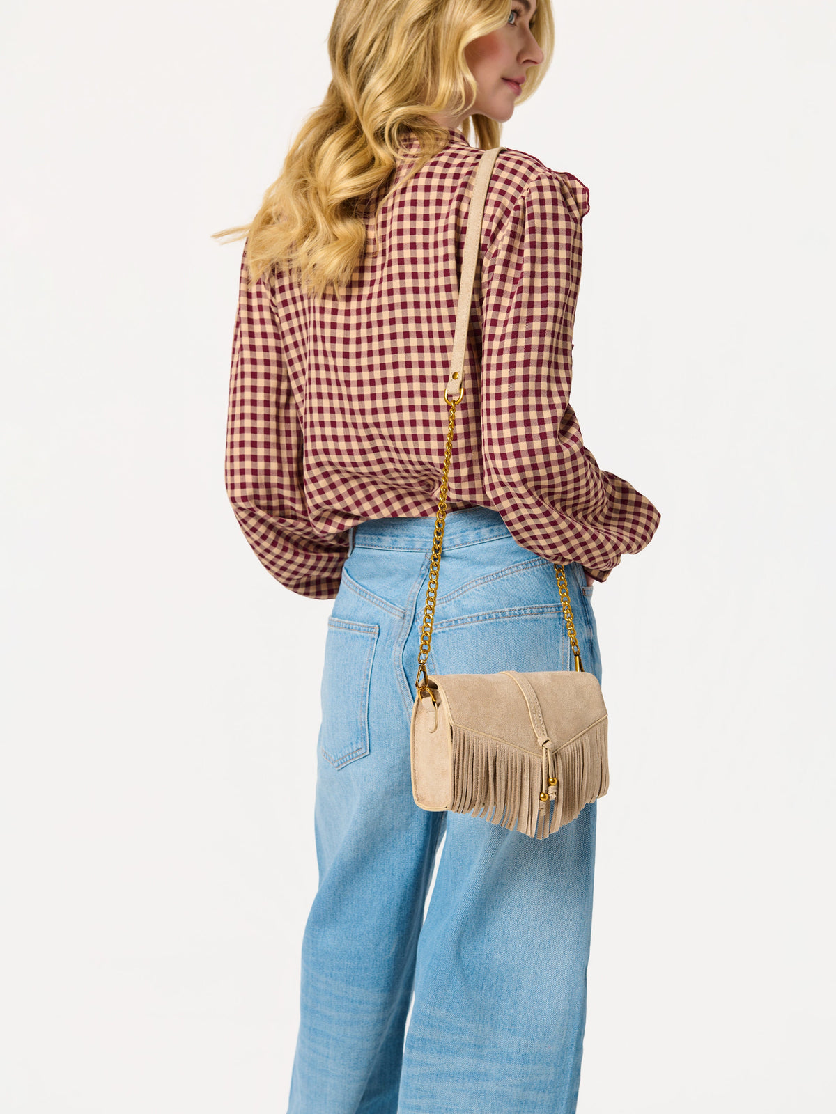 Janis Fringe Cross-Body Bag and Wristlet, shown in a styled setting