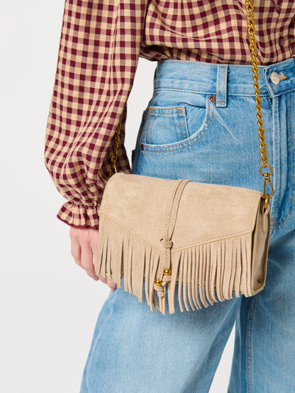 Janis Fringe Cross-Body Bag and Wristlet, shown in a styled setting