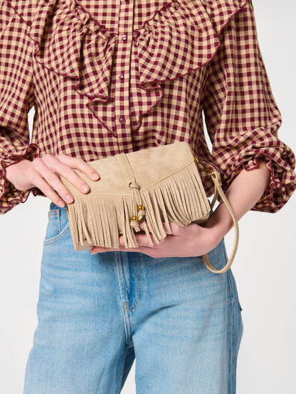 Janis Fringe Cross-Body Bag and Wristlet, shown in a styled setting