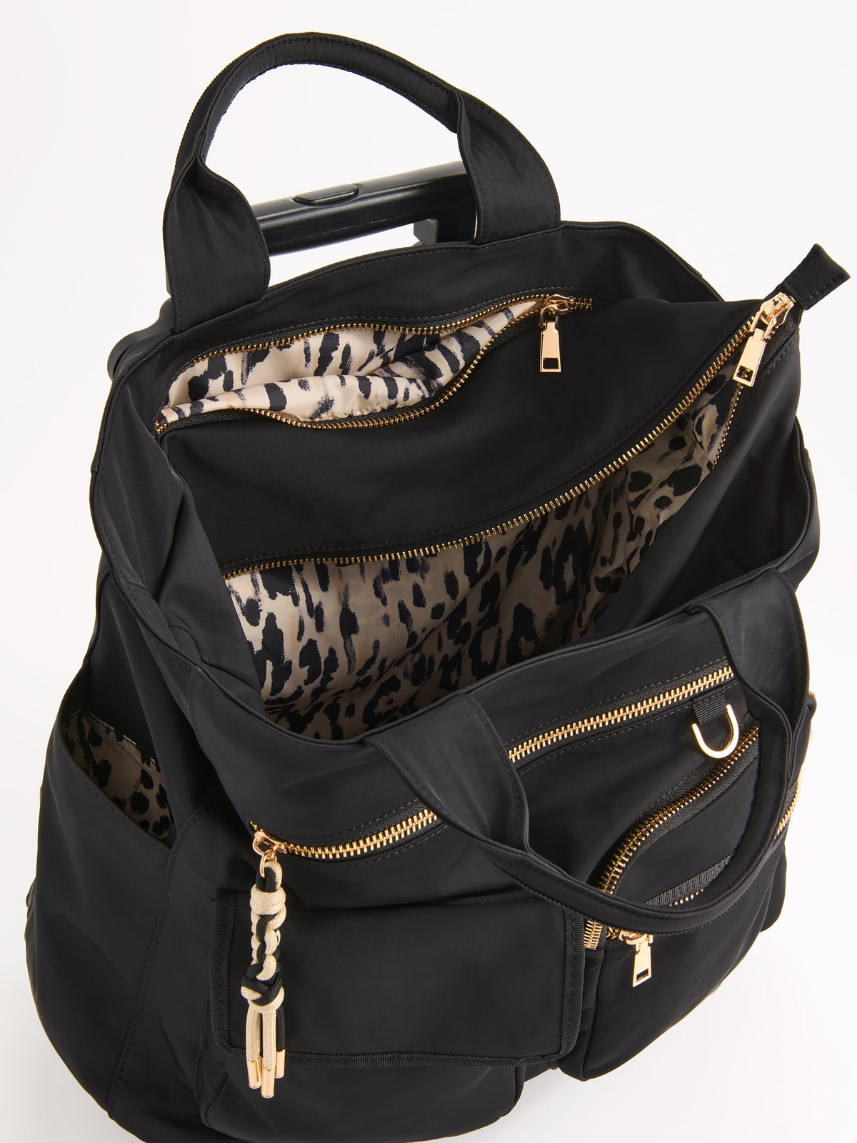 Jet 360 Roller Tote with Spinner Wheels, shown in a styled setting