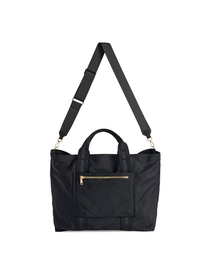 Jet Travel Tote with Cross-Body Strap, A black tote with two top handles, a long black cross-body strap, a front zip pocket and a cream knotted tassel on the zipper pull.