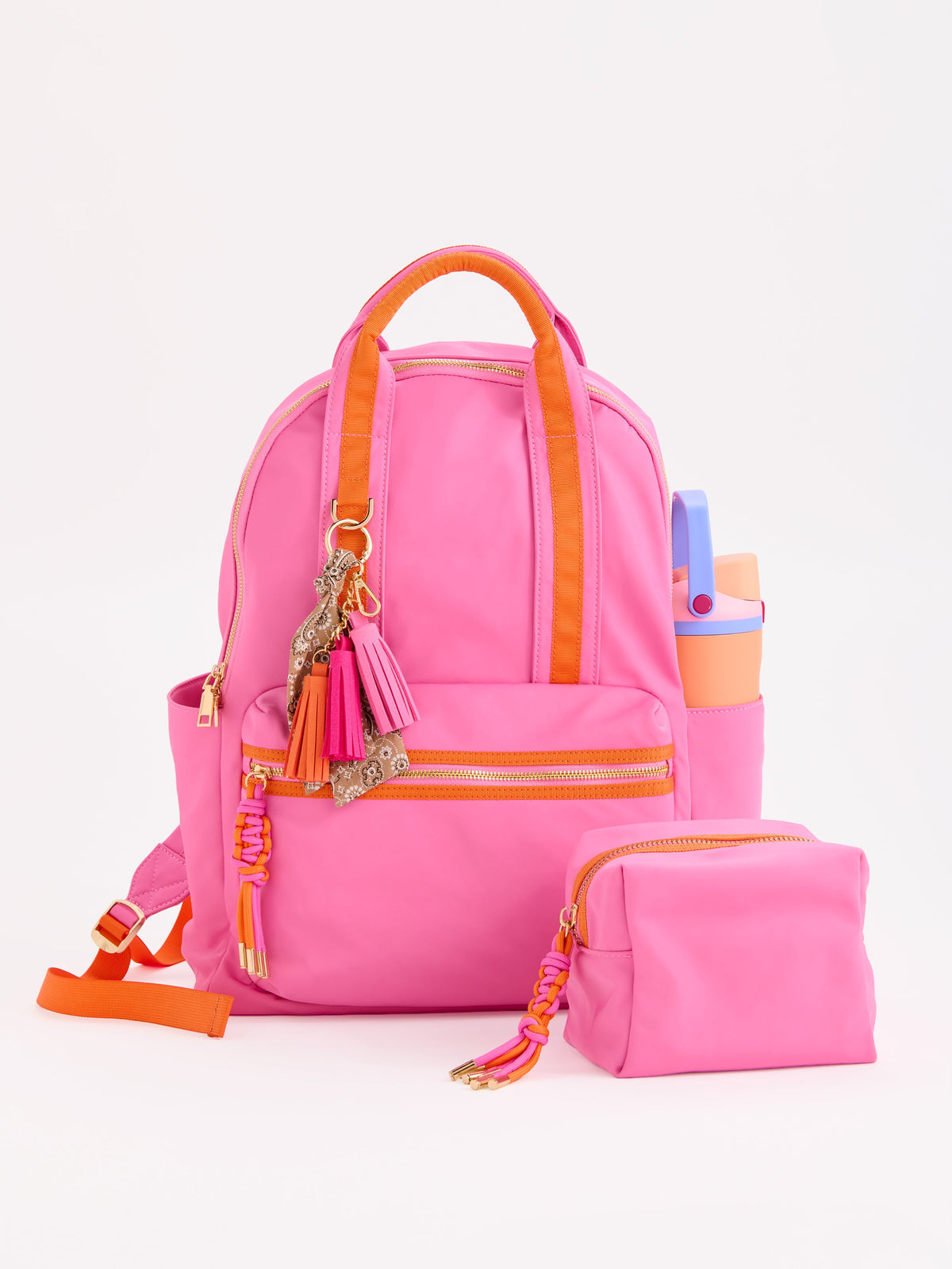 Jet Backpack with Inner Tech Sleeve, A navy backpack with bright green handles and zipper trim, a front zip pocket, side pockets and a green and navy tassel zipper pull.
