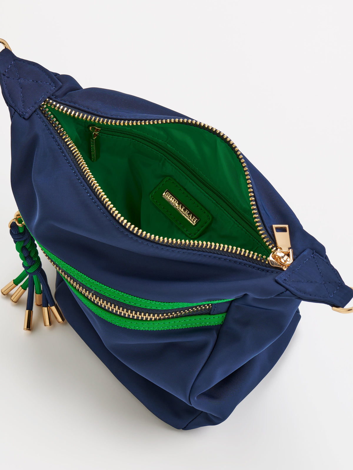 Jet Convertible Cross-Body Bag with Top Handles, shown in a styled setting