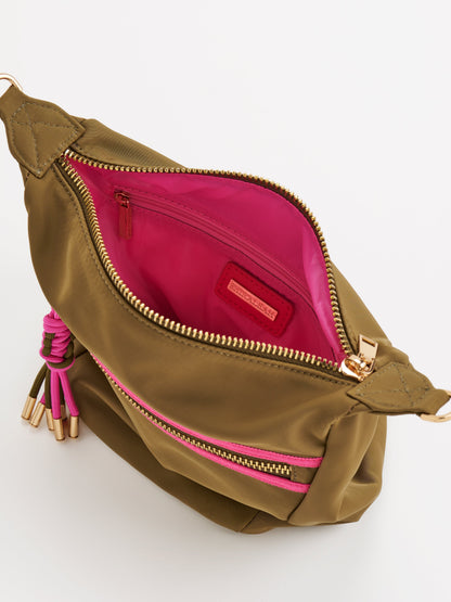 Jet Convertible Cross-Body Bag with Top Handles, shown in a styled setting