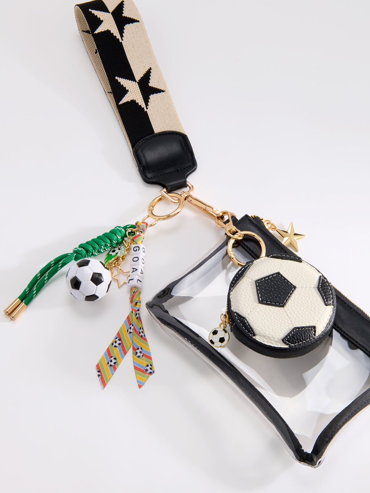 Spectator Clear Stadium Wristlet with Star Strap and Zip Pouch, shown in a styled setting