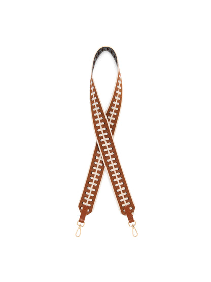 Football Lace Bag Strap, Brown, A wide brown woven strap with a cream football lace pattern, crossed in a loop with gold-tone clasps and brown tabs at both ends.