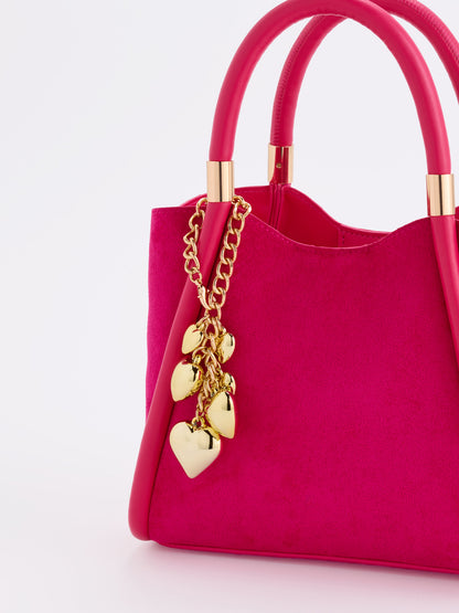 Hearts Bag Charm, Gold, shown in a styled setting