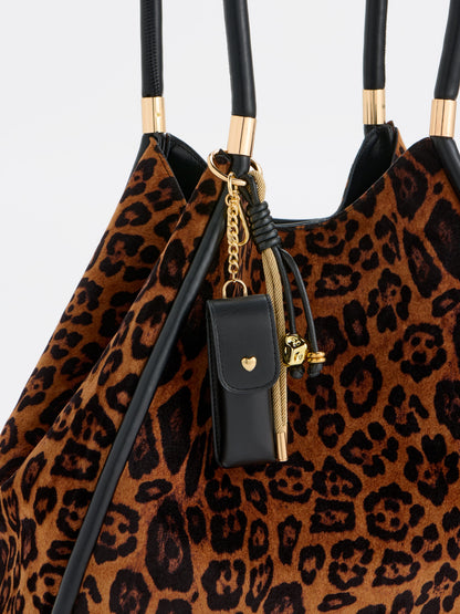 Lipstick Case Bag Charm and Key Ring, Black, shown in a styled setting