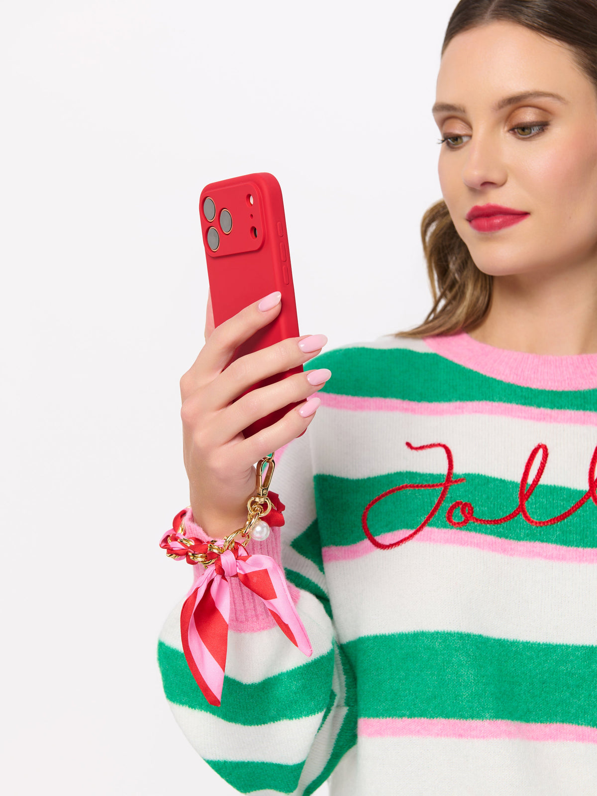Phone Wristlet with Scarf Bow and Gold-Tone Chain, shown in a styled setting