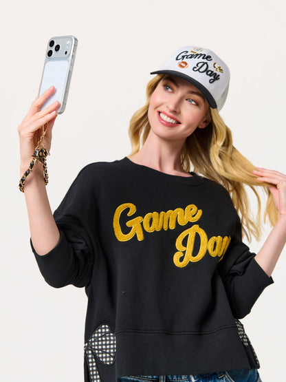 Taylor Football and Star Phone Wristlet with Chain Link Strap, shown in a styled setting