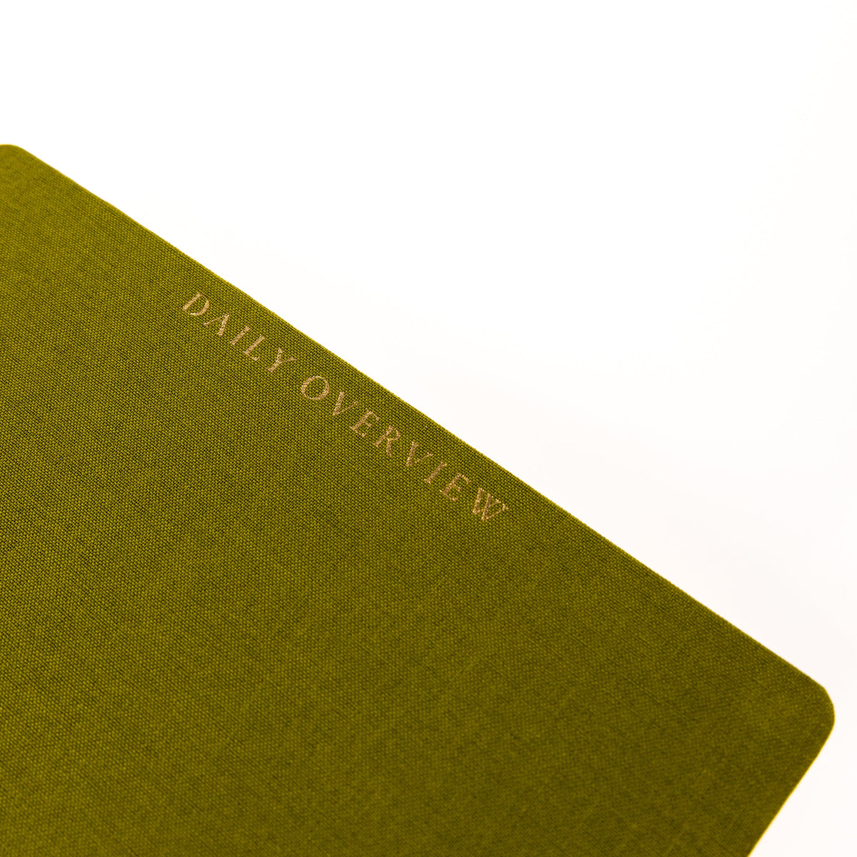 Olive Green Fabric-Bound Task Journal, An olive green fabric task journal with Daily Overview lettered in gold foil down the spine edge.