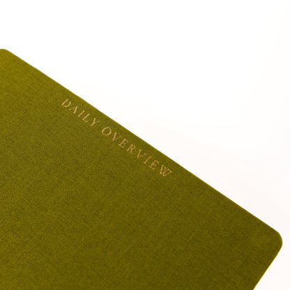 Olive Green Fabric-Bound Task Journal, An olive green fabric task journal with Daily Overview lettered in gold foil down the spine edge.