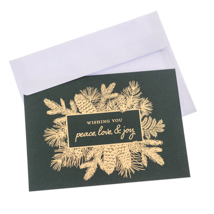 Peace Holiday Keepsake Boxed Cards, A dark green boxed Christmas card set with a gold foil pinecone and pine bough design reading Wishing you peace, love, and joy.