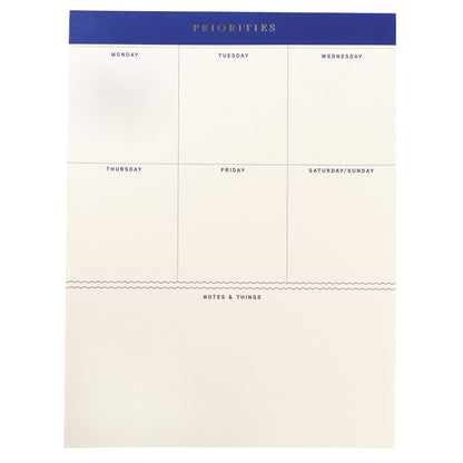 Cobalt Blue Legal Pad, A cream weekly planning pad with a cobalt blue header reading Priorities and a Monday through Sunday grid.