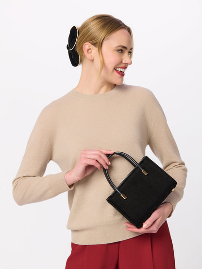 Velvet Claw Hair Clip, Black, shown in a styled setting