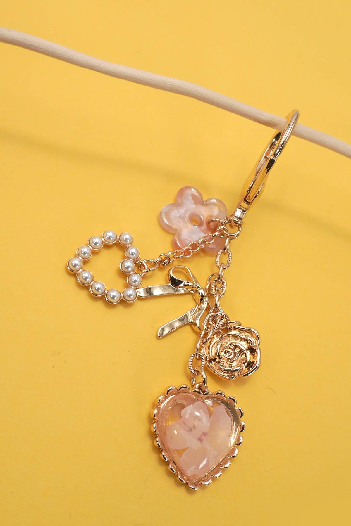 JOSSLYN by wall to wall - BAG CHARM- PRESSED FLOWER BOW PEARL HEART CHARMS | 80K026