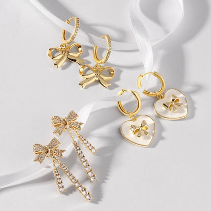 Huggies With Bow Accented White Heart