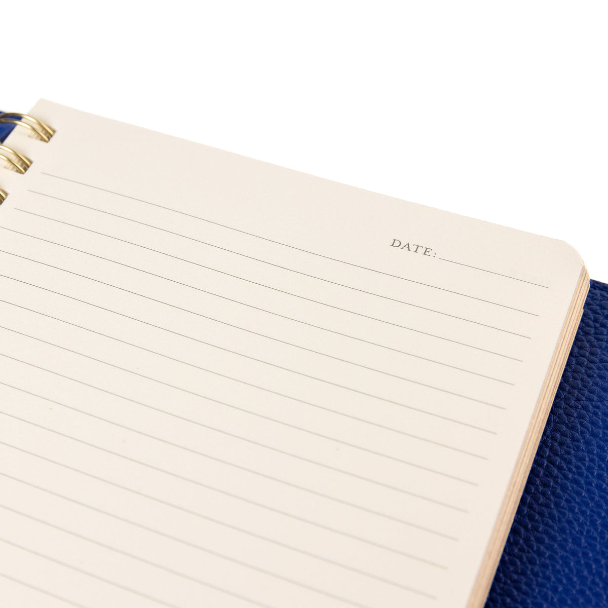 Cobalt Blue Vegan Leather Wrap Journal, A cobalt blue vegan leather wrap journal with a scalloped flap and pebbled texture, shown open with its frosted spiral insert.