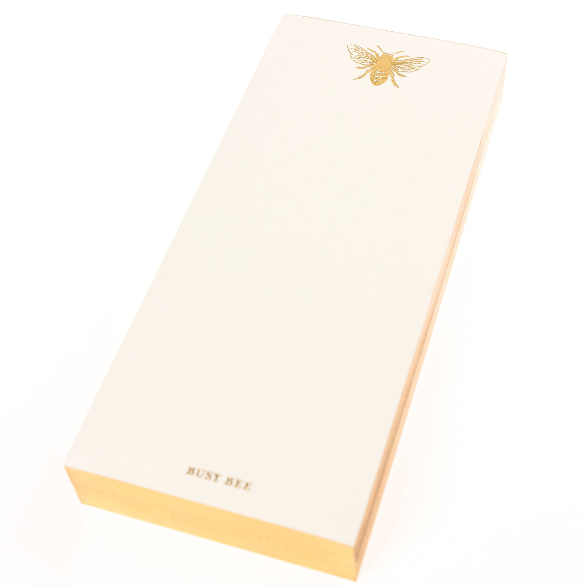 La Petite Presse Bee Gilded Desktop Notepad, A cream notepad with a gold foil bee at the top and the words Busy Bee stamped in gold at the bottom, with a gold gilded edge.