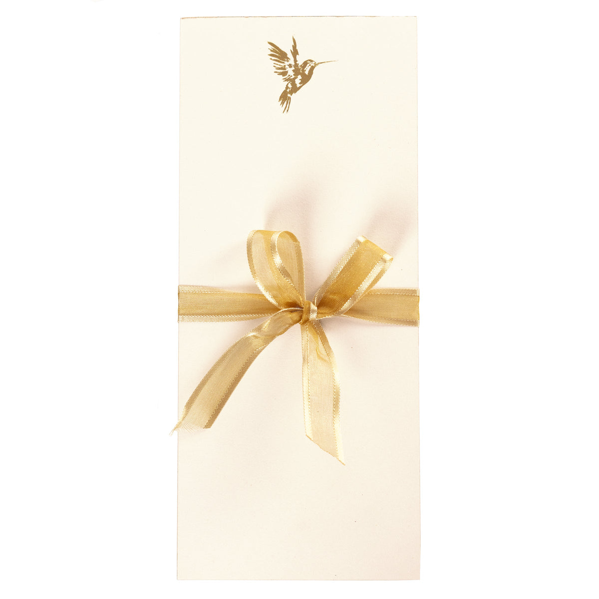 La Petite Presse Hummingbird Gilded Desktop Notepad, A cream notepad with a gold foil hummingbird at the top corner and a gold gilded edge, tied with a gold ribbon.