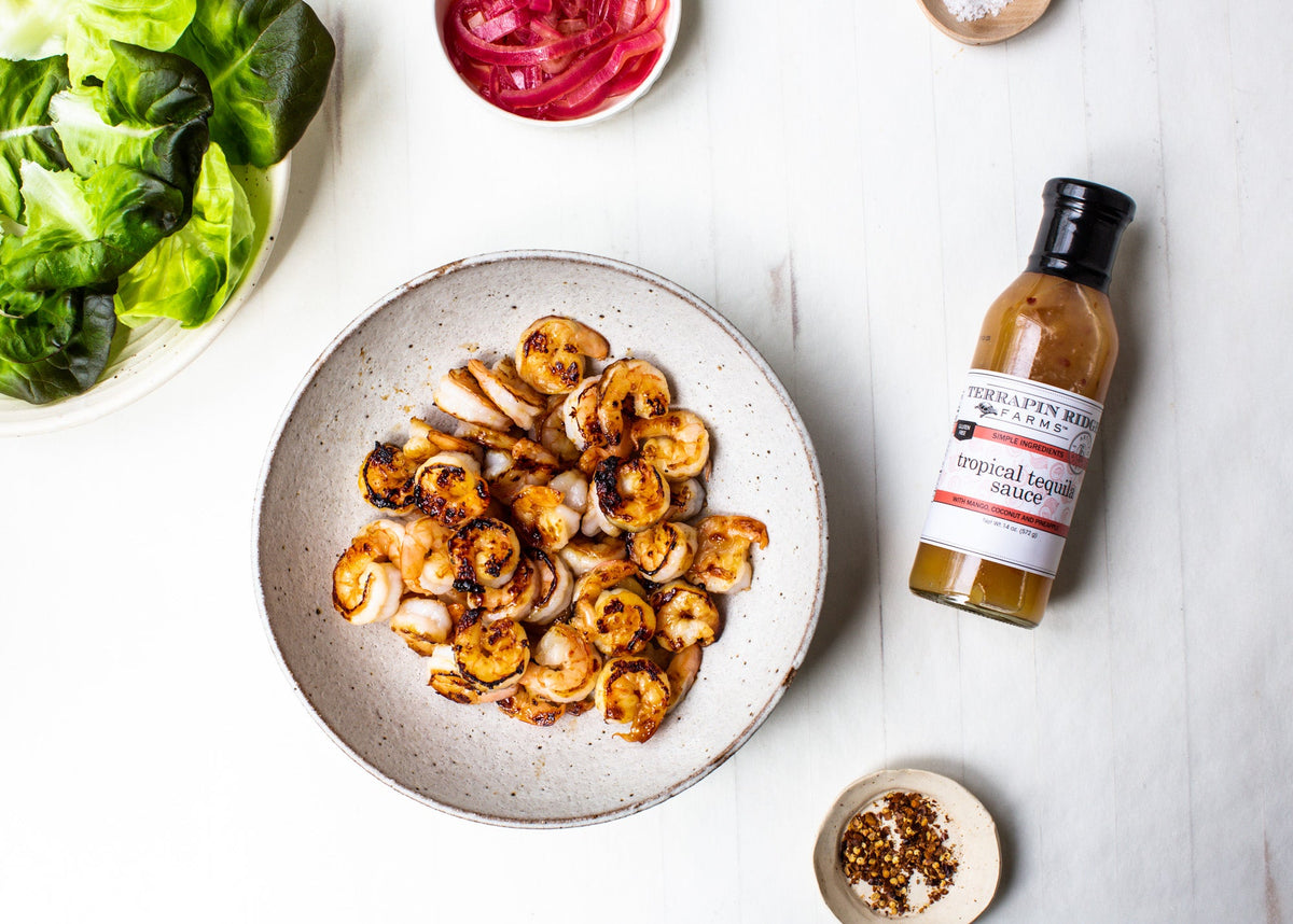 Tropical Tequila Sauce, 14.5 oz, shown in a styled setting