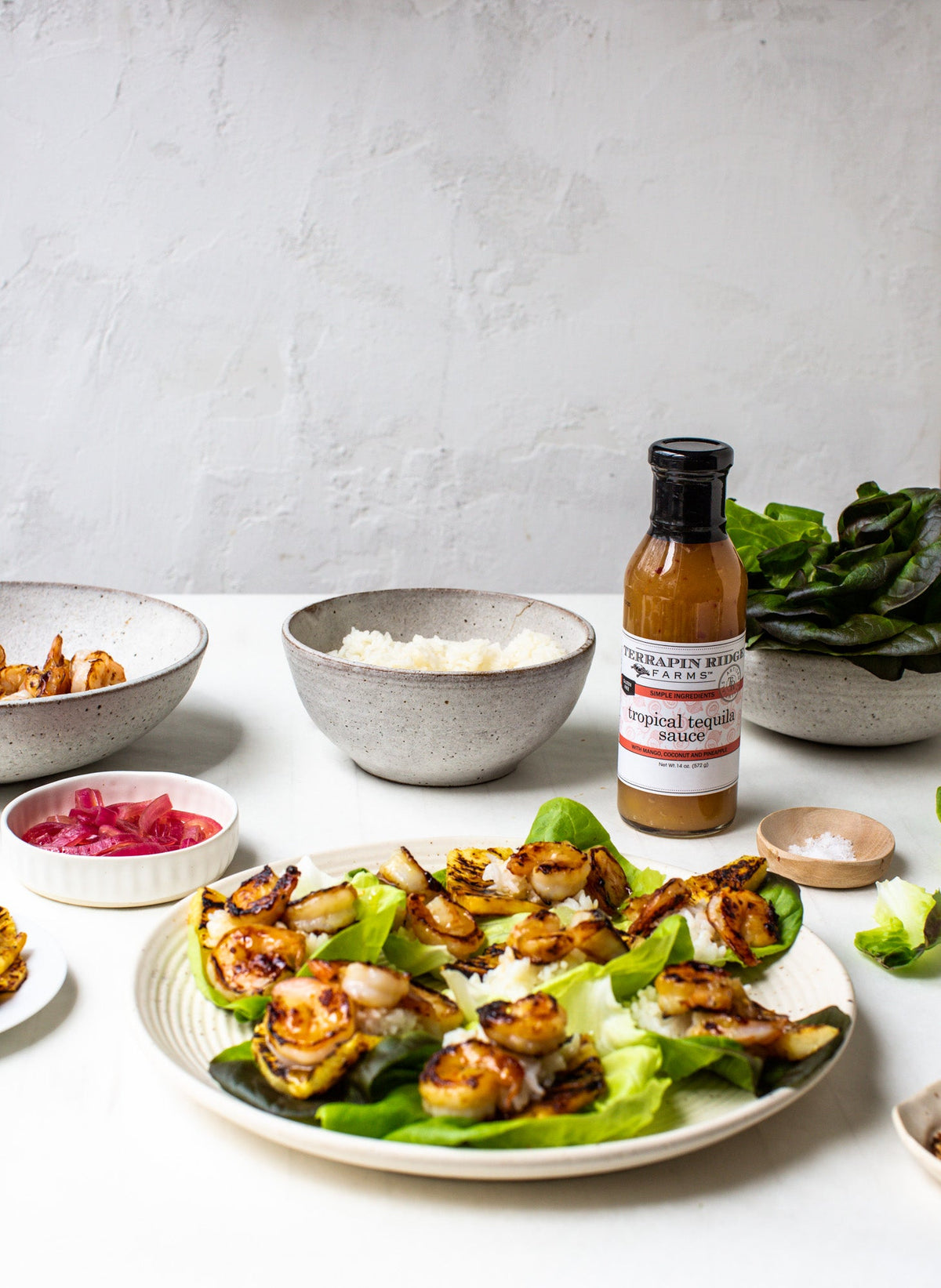 Tropical Tequila Sauce, 14.5 oz, shown in a styled setting